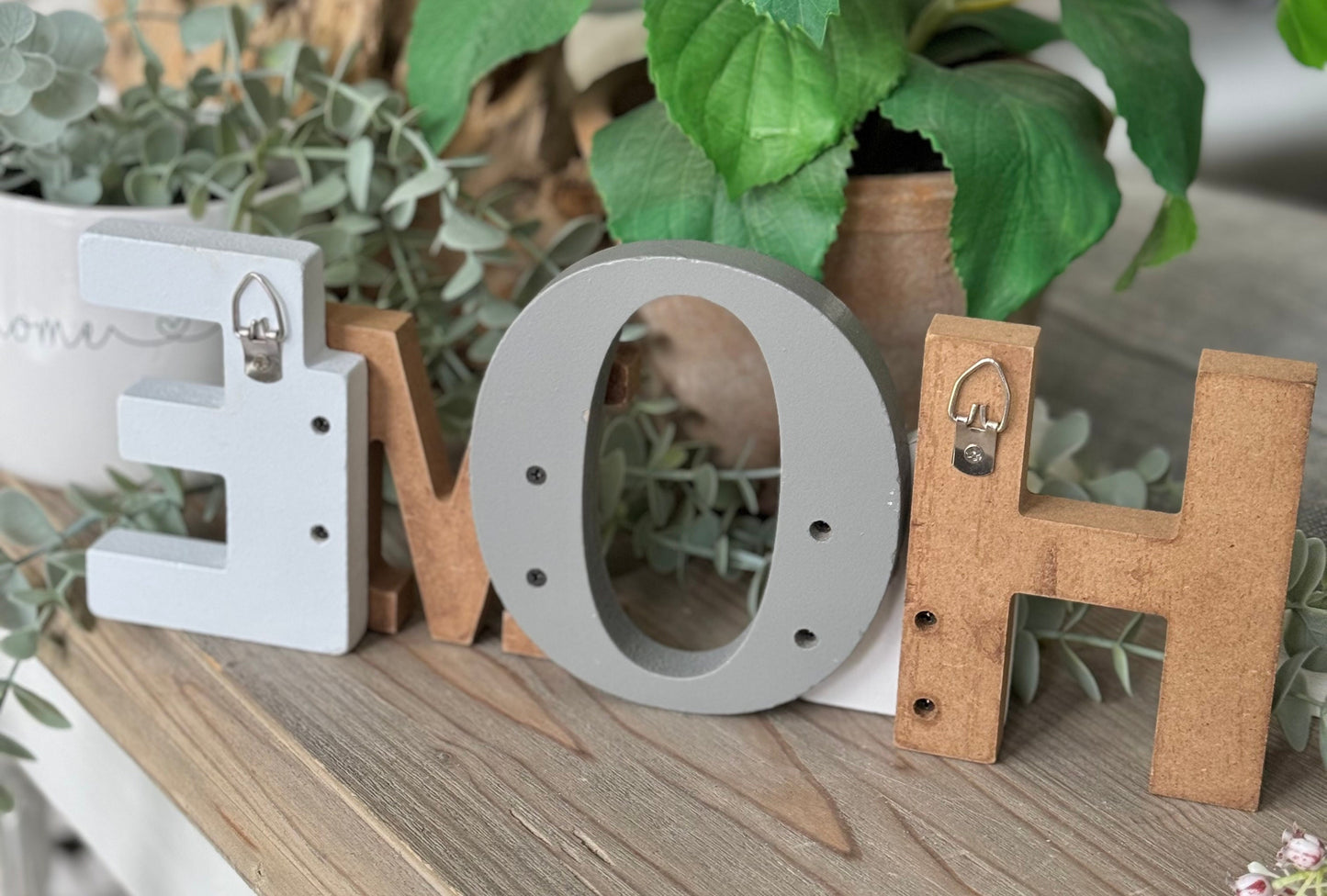 Freestanding classic wooden "HOME" sign.