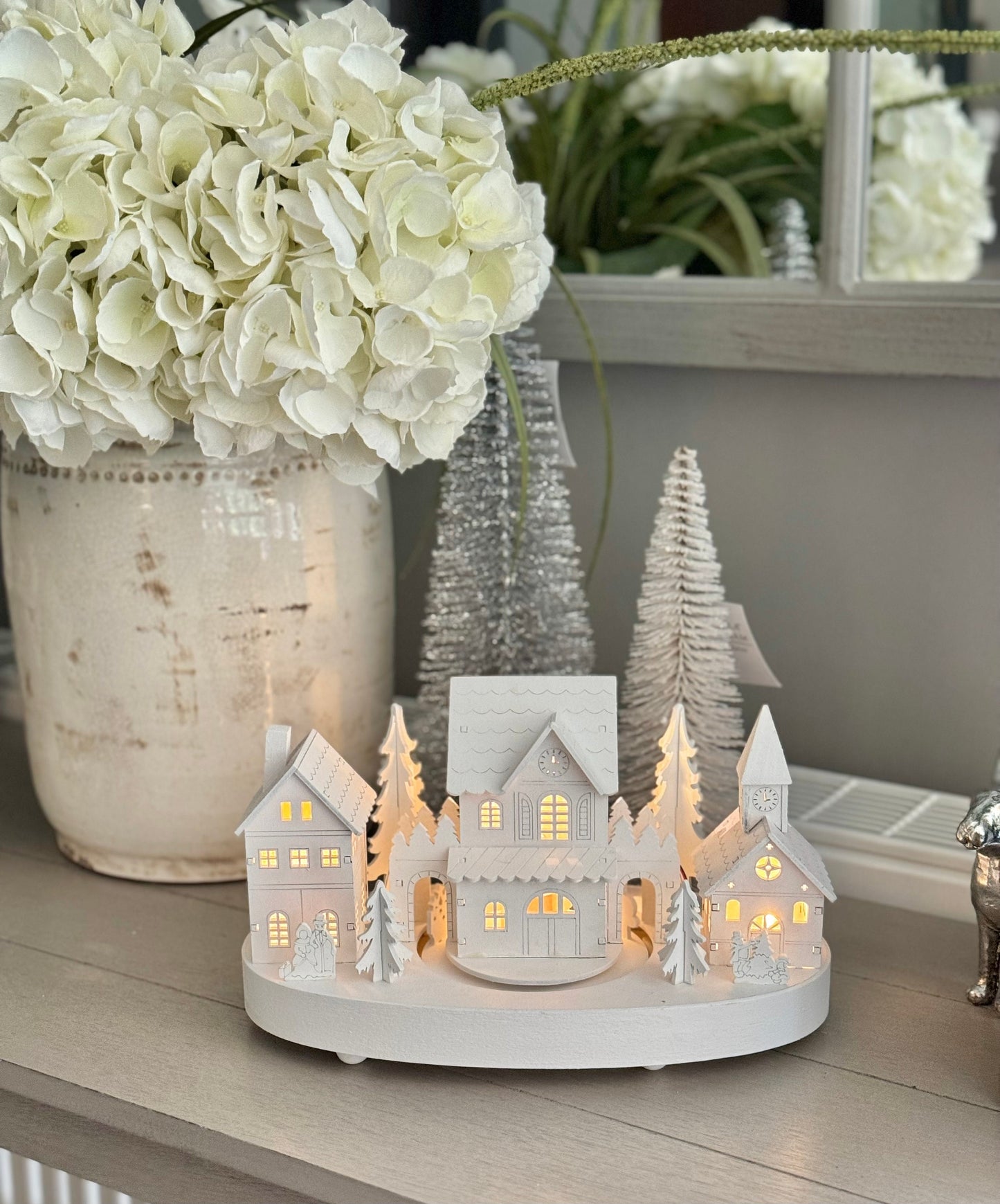 White Wooden Christmas Village Scene With Moving Train And Lights.