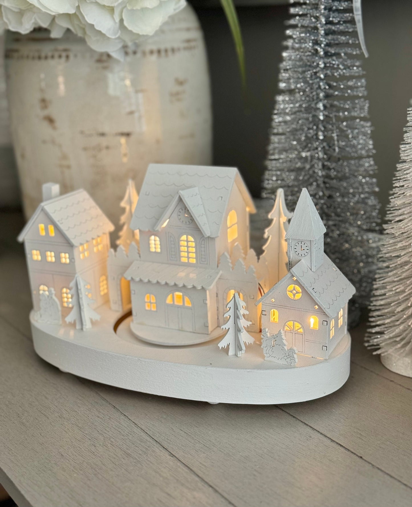 White Wooden Christmas Village Scene With Moving Train And Lights.