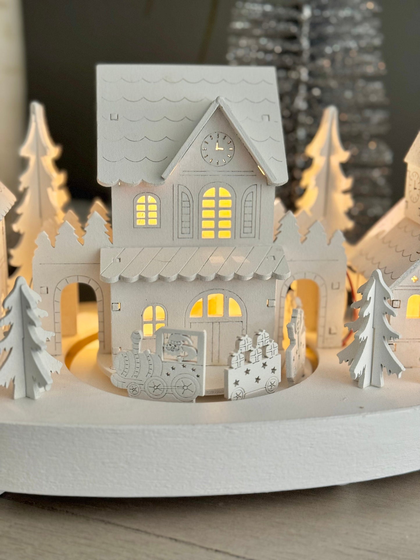 White Wooden Christmas Village Scene With Moving Train And Lights.