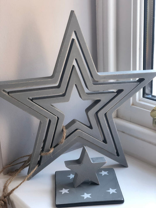 Set of 4 Grey Wooden Stars.